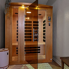 Luxury wooden sauna room with glass door