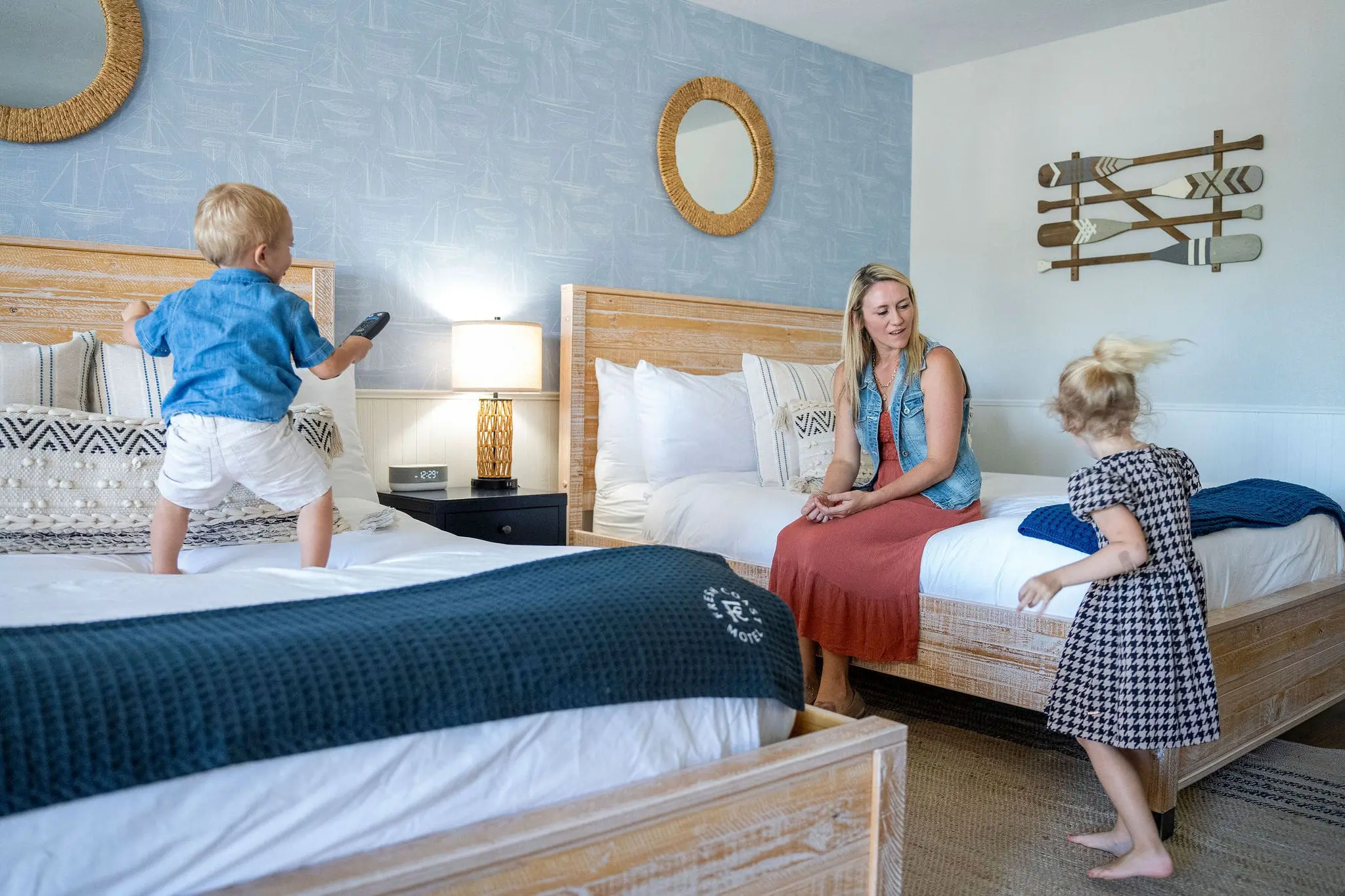 Family enjoying time in cozy hotel room.